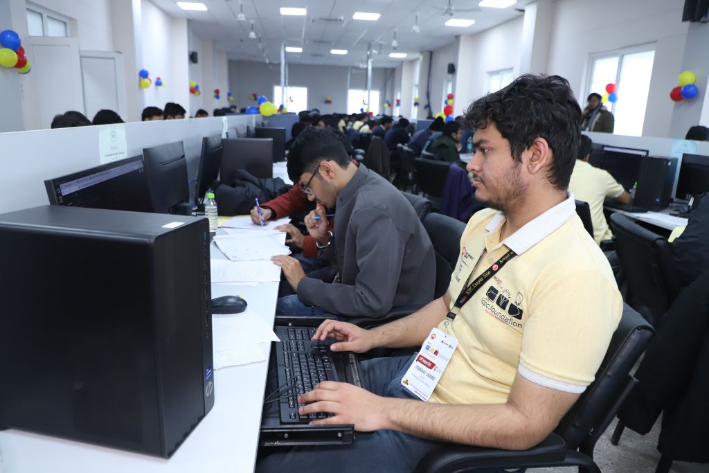 Contestants solving problems at their workstation